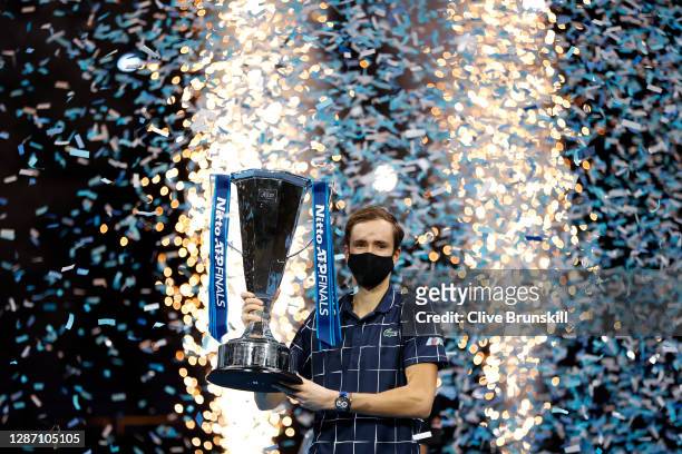 Daniil Medvedev of Russia lifts the trophy after winning his singles final match against Dominic Thiem of Austria during day eight of the Nitto ATP...