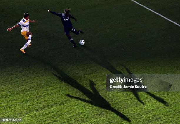 Gerso of Sporting Kansas City crosses the ball as Nick Lima of San Jose Earthquakes defends during the MLS Cup playoff game at Children's Mercy Park...