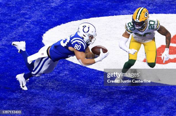 Trey Burton of the Indianapolis Colts makes a touchdown reception during the second quarter against the Green Bay Packers in the game at Lucas Oil...