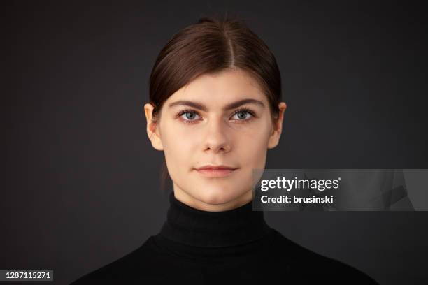 studio portrait of 20 year old woman - hair back stock pictures, royalty-free photos & images