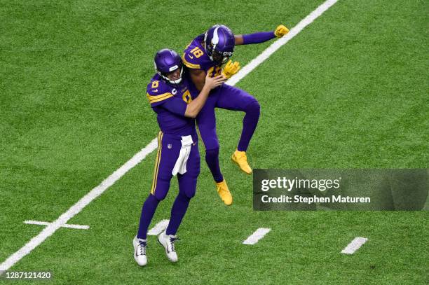 Kirk Cousins and Justin Jefferson of the Minnesota Vikings celebrate following a touchdown catch during their game against the Dallas Cowboys at U.S....