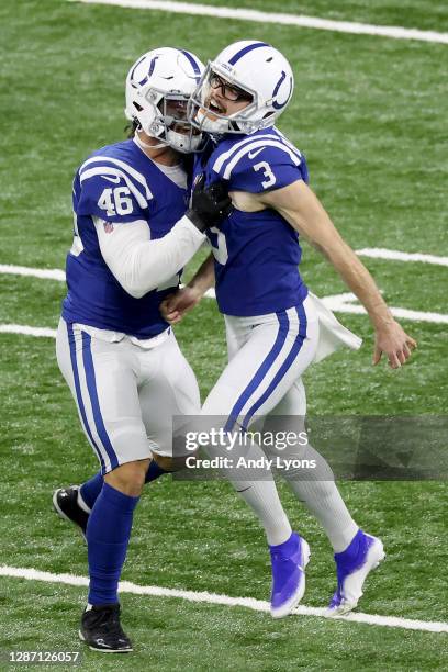 Rodrigo Blankenship of the Indianapolis Colts celebrates with Luke Rhodes after kicking the game winning field goal to defeat the Green Bay Packers...