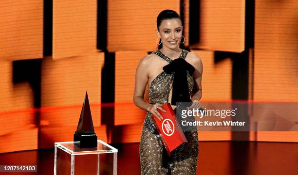In this image released on November 22, Christian Serratos speaks onstage for the 2020 American Music Awards at Microsoft Theater on November 22, 2020...