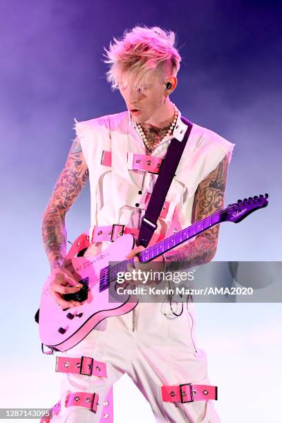 In this image released on November 22, Machine Gun Kelly performs onstage for the 2020 American Music Awards at Microsoft Theater on November 22,...