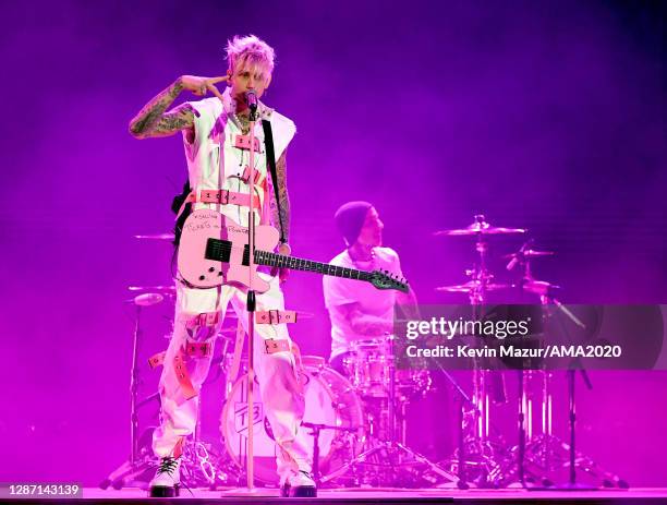 In this image released on November 22, Machine Gun Kelly and Travis Barker perform onstage for the 2020 American Music Awards at Microsoft Theater on...