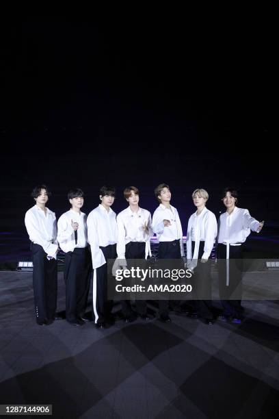In this image released on November 22, Jungkook, Suga, V, Jin, RM, Jimin, and J-Hope of BTS perform onstage for the 2020 American Music Awards on...