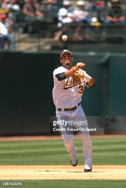 Eric Chavez of the Oakland Athletics throws to first base against the Chicago White Sox during an Major League Baseball game July 2, 2005 at the...