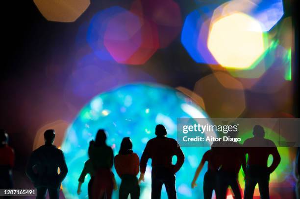 a group of people observe the universe and its planets. - all age party stock-fotos und bilder