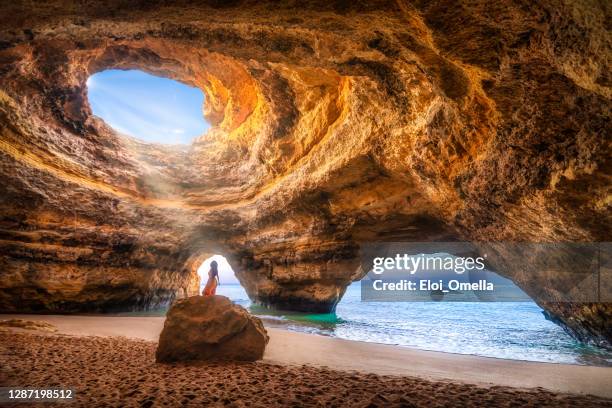 beatuful frau in benagil cave, algarve, portugal - site naturel stock-fotos und bilder