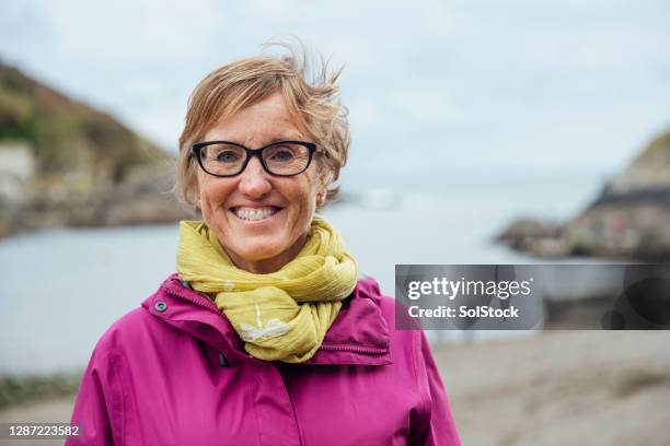 mature woman in polperro - 55 years old stock pictures, royalty-free photos & images