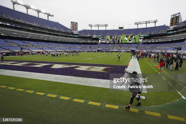 Team photographer for the Baltimore Ravens walks the sidelines during the first half at M&T Bank Stadium on November 22, 2020 in Baltimore, Maryland....