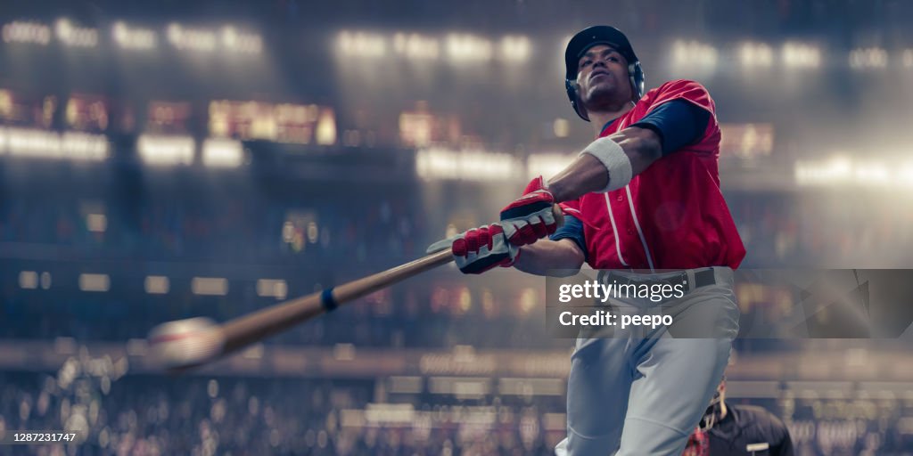 Professional Baseball Batter Hitting Baseball In Mid-Swing Close Up