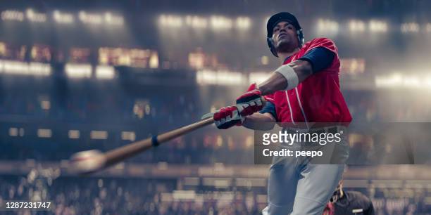 professional baseball batter hitting baseball in mid-swing close up - baseball stock pictures, royalty-free photos & images