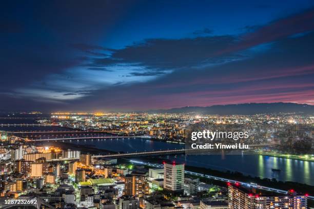 night view of the city skyline of osaka, japan - osaka skyline stock pictures, royalty-free photos & images