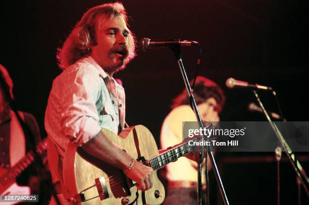 Singer-songwriter Jimmy Buffett performs with The Coral Reefer Band at The Omni Coliseum on September 4, 1976 in Atlanta, Georgia.