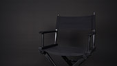Black director chair use in video production , movie ,film, cinema industry on black background