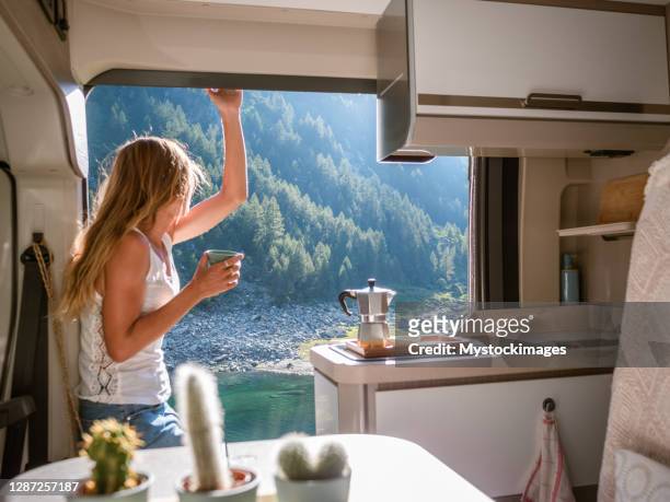 woman enjoys fresh italian coffee from her van - trailer imagens e fotografias de stock