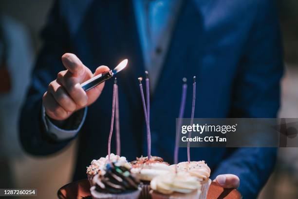 surprise office birthday party celebration - cigarette lighter stock pictures, royalty-free photos & images