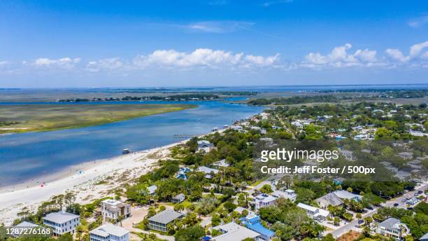 aerial view of beach against blue sky,tybee island,georgia,united states,usa - tybee island stock pictures, royalty-free photos & images