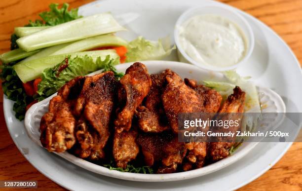high angle view of food in plate on table,denver,colorado,united states,usa - buffalo chicken wings stock pictures, royalty-free photos & images