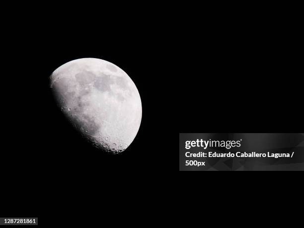 low angle view of moon against clear sky at night - caballero stock pictures, royalty-free photos & images