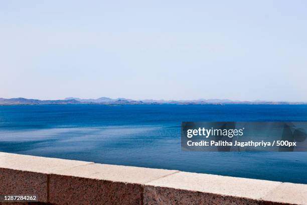 scenic view of sea against clear sky,aswan,aswan governorate,egypt - aswan dam stock pictures, royalty-free photos & images