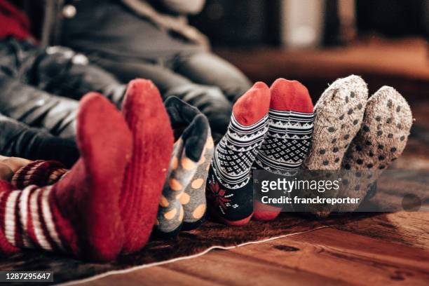 christmas at home all together - socks fireplace stock pictures, royalty-free photos & images