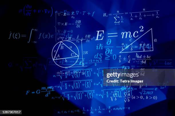 mathematical formulas on blue background - mathematische formel stock-fotos und bilder