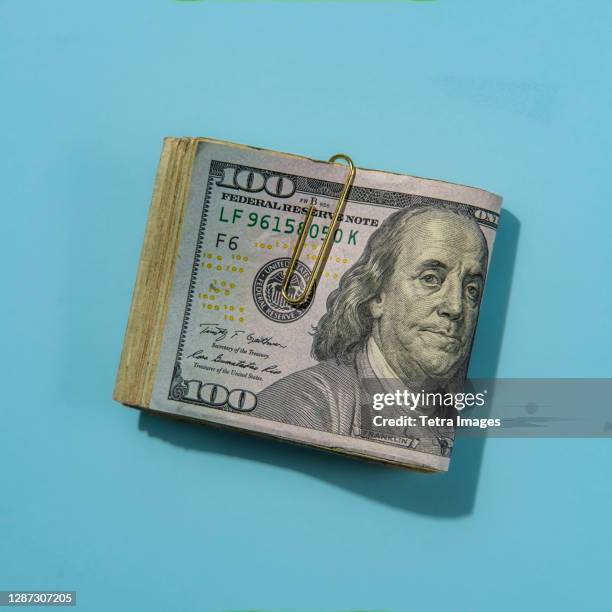 wad of us dollar bills - money roll stock pictures, royalty-free photos & images