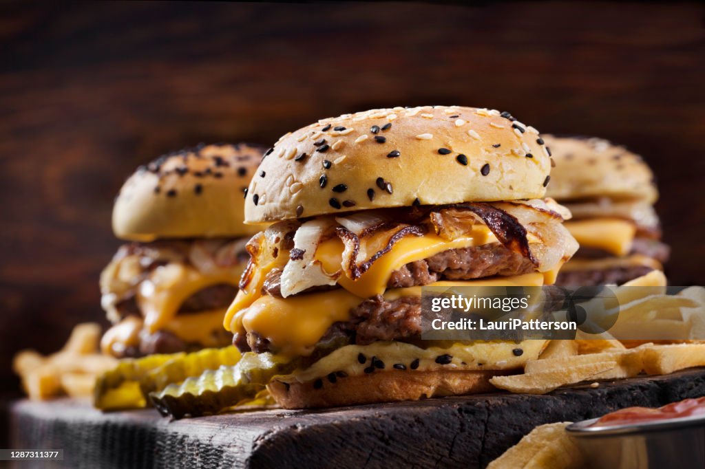 Double Cheese Burger Sliders with Fried Onions, Pickles on a Brioche Sesame Seed Buns with Fries