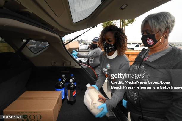 Members of the Delta Sigma Theta sorority volunteered to load up cars with food during the SoFi Stadium and Hollywood Park Annual City of Inglewood...