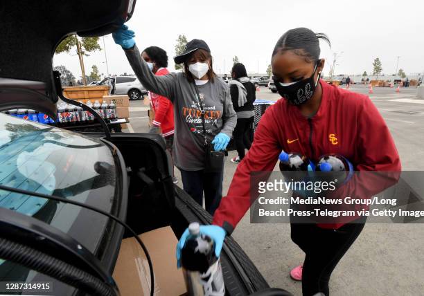 Members of the Delta Sigma Theta sorority volunteered to load up cars with food during the SoFi Stadium and Hollywood Park Annual City of Inglewood...