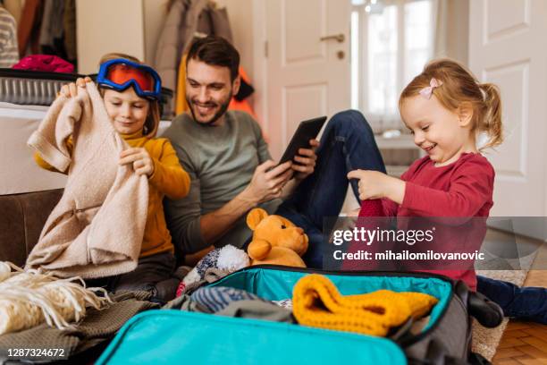 they have their own suitcases - warm clothing stock pictures, royalty-free photos & images