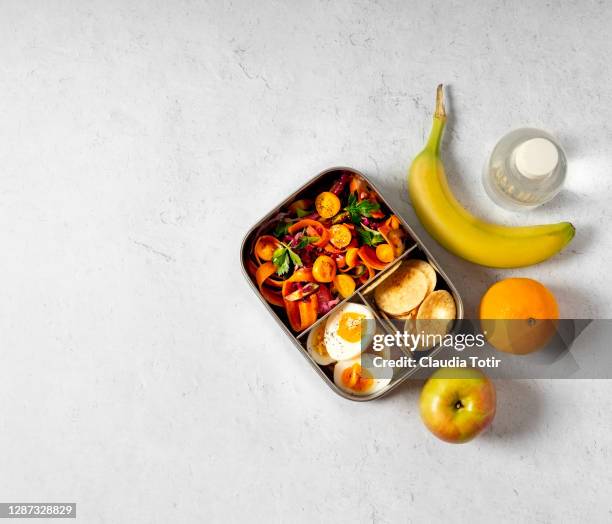 lunch box with fruits, and a bottle of water on white background - lunchlåda bildbanksfoton och bilder