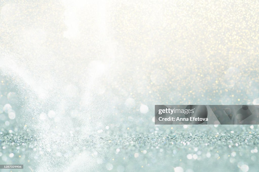 Abstract background made with illuminating glittering sparkles. New Year coming concept.