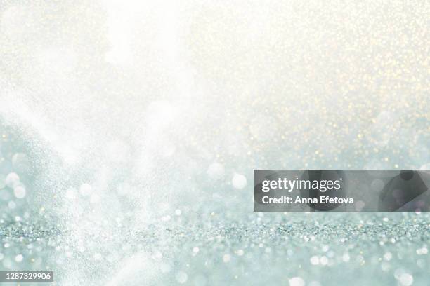 abstract background made with illuminating glittering sparkles. new year coming concept. - blue confetti stockfoto's en -beelden
