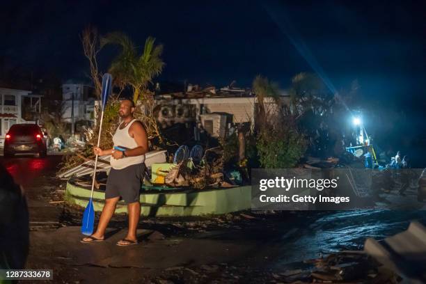 Man stands guard on November 22, 2020 in the center of Providencia, Colombia. The islands of San Andres, Providencia and Santa Catalina were hit by...