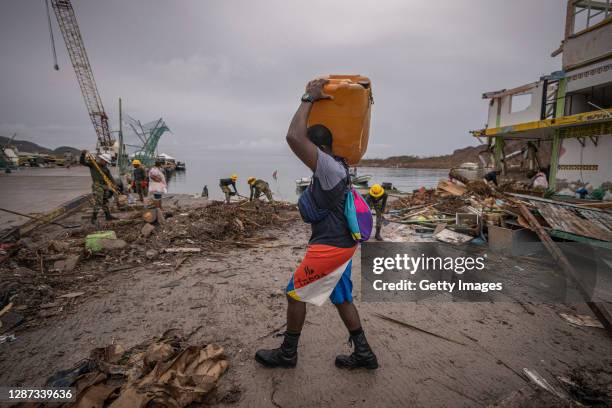 Man brings fuel for boats in the port on November 22, 2020 in Providencia, Colombia. The islands of San Andres, Providencia and Santa Catalina were...