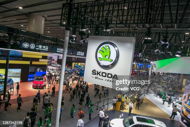 People visit the Skoda booth during the 18th Guangzhou International Automobile Exhibition at China Import and Export Fair Complex on November 23,...