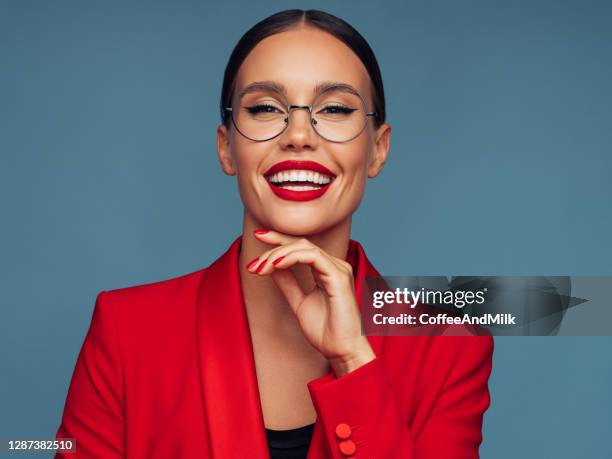 beautiful emotional woman - red spectacles stock pictures, royalty-free photos & images