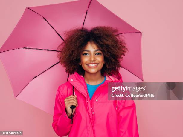 afro girl with pink umbrella - female fashion with umbrella stock pictures, royalty-free photos & images