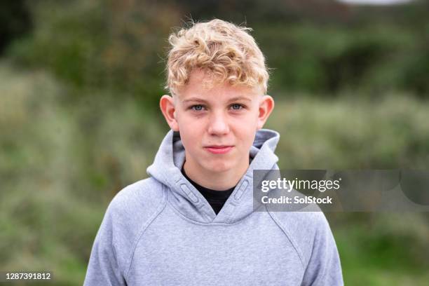 headshot of a caucasian teenage boy - blonde youth culture stock pictures, royalty-free photos & images