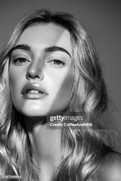 portrait of a beautiful woman with natural make-up - skin care black and white portrait stock pictures, royalty-free photos & images