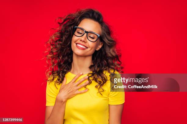 inspired smiling woman - curly red hair glasses stock pictures, royalty-free photos & images