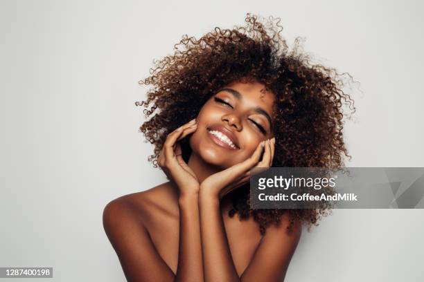 beautiful afro woman with perfect make-up - body care and beauty stock pictures, royalty-free photos & images