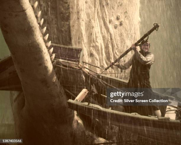American actor Gregory Peck as Captain Ahab, battling the great white whale in the film 'Moby Dick', adapted from Herman Melville's classic novel,...
