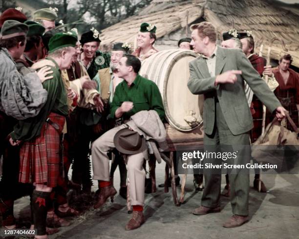 American actors Gene Kelly as Tommy Albright and Van Johnson as Jeff Douglas in the MGM musical film 'Brigadoon', 1954.