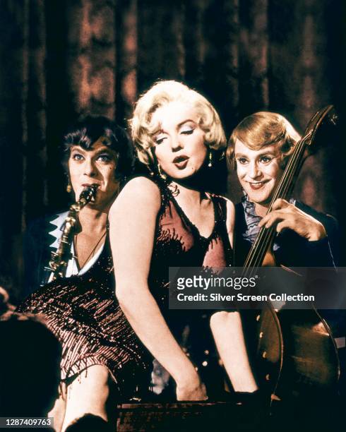 From left to right, actors Tony Curtis as saxophone player Joe/Josephine, Marilyn Monroe as singer Sugar Kane Kowalczyk and Jack Lemmon as double...