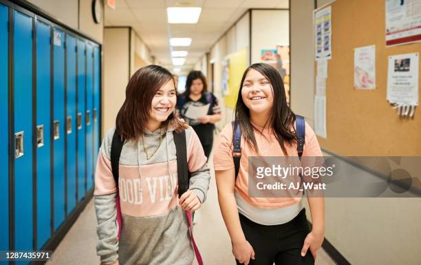 girls returning home after school - last day of school stock pictures, royalty-free photos & images