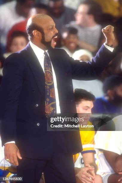 Washington, D.C Head coach Mike Jarvis of the George Washington Colonials signals to his players during a college basketball game against the Rutgers...